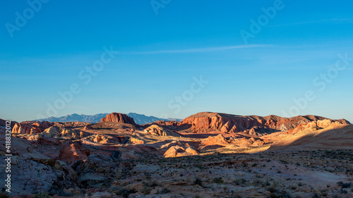 Valley of Fire State Park Ultrawide Panorama of golden hour lighting up red sandstone domes in Clark County, Nevada between Las Vegas and Zion National Park.