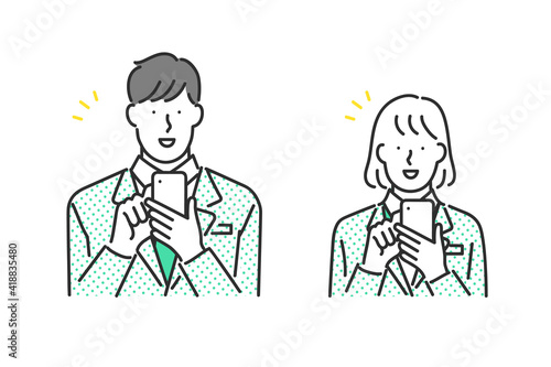 スマホを操作する男子学生と女子学生のイラスト素材
