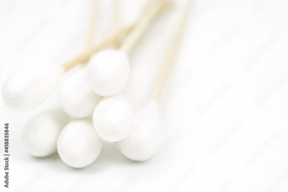 Close-Up Cotton bud wood stick or cotton swab on background.
Close-Up Cotton bud wood stick or cotton swab on background.