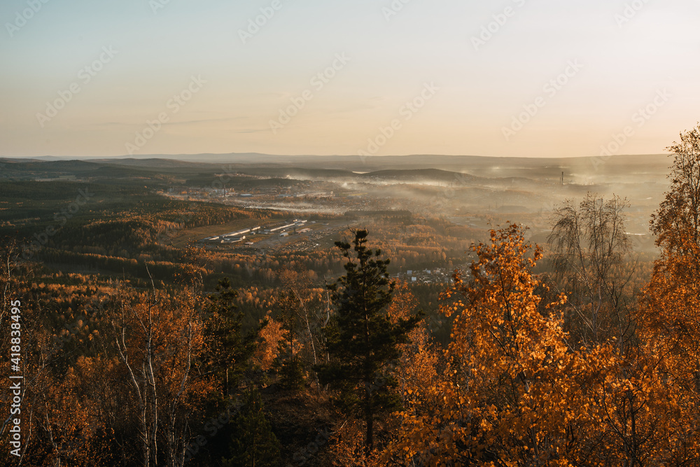 Fototapeta premium autumn view from the mountain to the fog