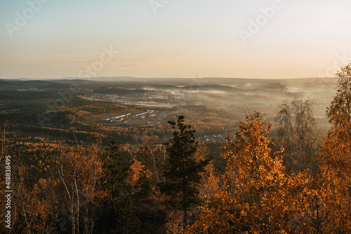 autumn view from the mountain to the fog