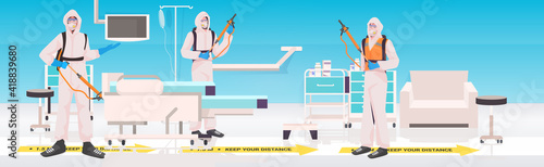 professional cleaners in hazmat suits janitors cleaning and disinfecting coronavirus cells hospital ward interior horizontal full length vector illustration