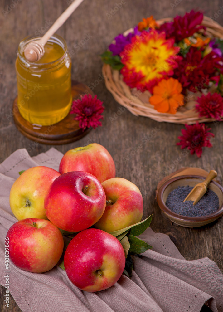 Apple and honey, traditional food of jewish New Year celebration, Rosh Hashana. Selective focus. Copyspace background Apple and honey, traditional food of jewish New Year celebration, Rosh Hashana. Selective focus. Copyspace background