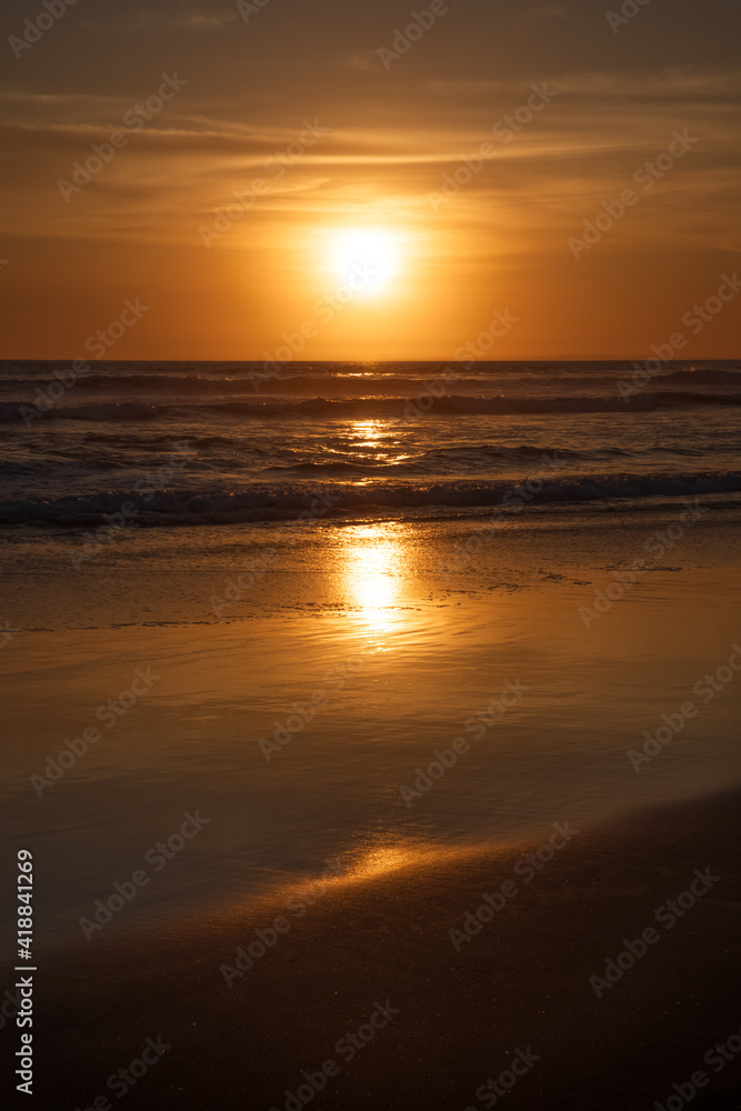 Sunset and beach. Seascape background. Bright sunlight. Sun at horizon line. Scenic view. Sunset golden hour. Sunlight reflection in water. Magnificent scenery. Copy space. Bali