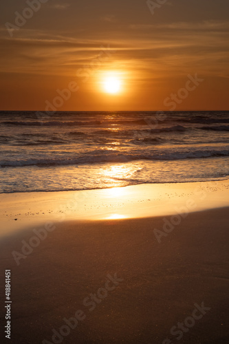 Fototapeta Naklejka Na Ścianę i Meble -  Sunset and beach. Seascape background. Bright sunlight. Sun at horizon line. Scenic view. Sunset golden hour. Sunlight reflection in water. Magnificent scenery. Copy space. Bali