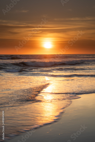 Sunset and beach. Seascape background. Bright sunlight. Sun at horizon line. Scenic view. Sunset golden hour. Sunlight reflection in water. Magnificent scenery. Copy space. Bali