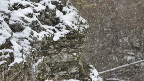 Wallpaper Mural Snow is falling on the rocks. Snowflakes are slowly falling. Winter beauty Torontodigital.ca