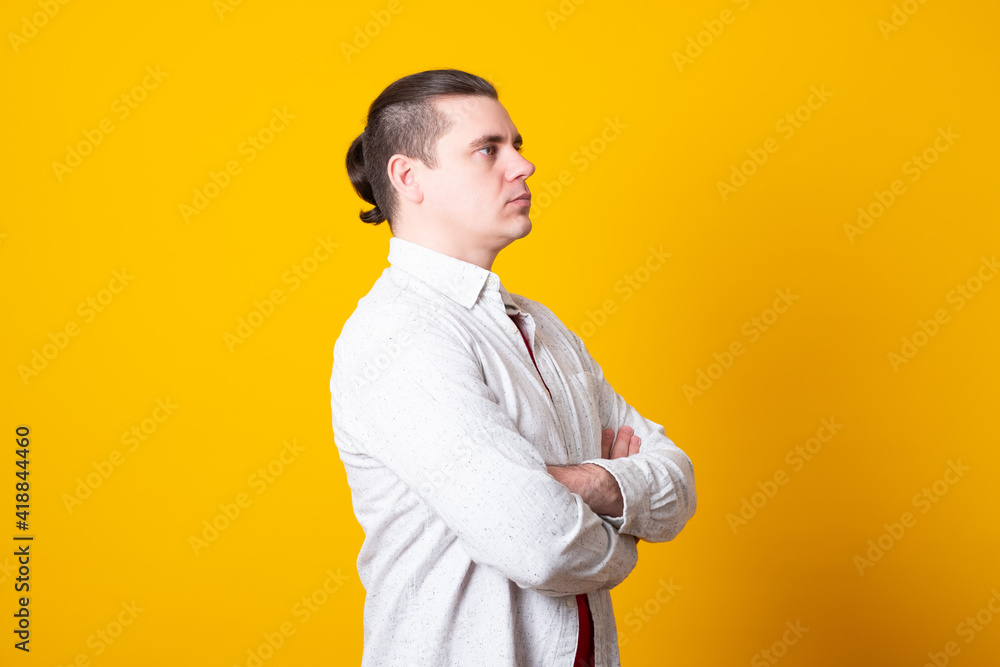 Portrait of handsome young man in casual shirt keeping arms crossed. Portrait of handsome young man in casual shirt keeping arms crossed.