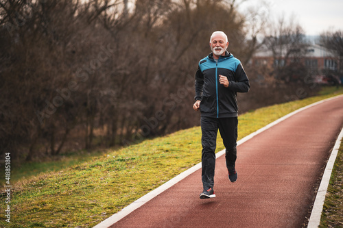 Active senior man is jogging. Healthy retirement lifestyle. © djoronimo