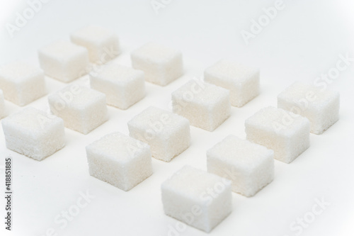 sugar cubes glucose ingredient calories energy light background