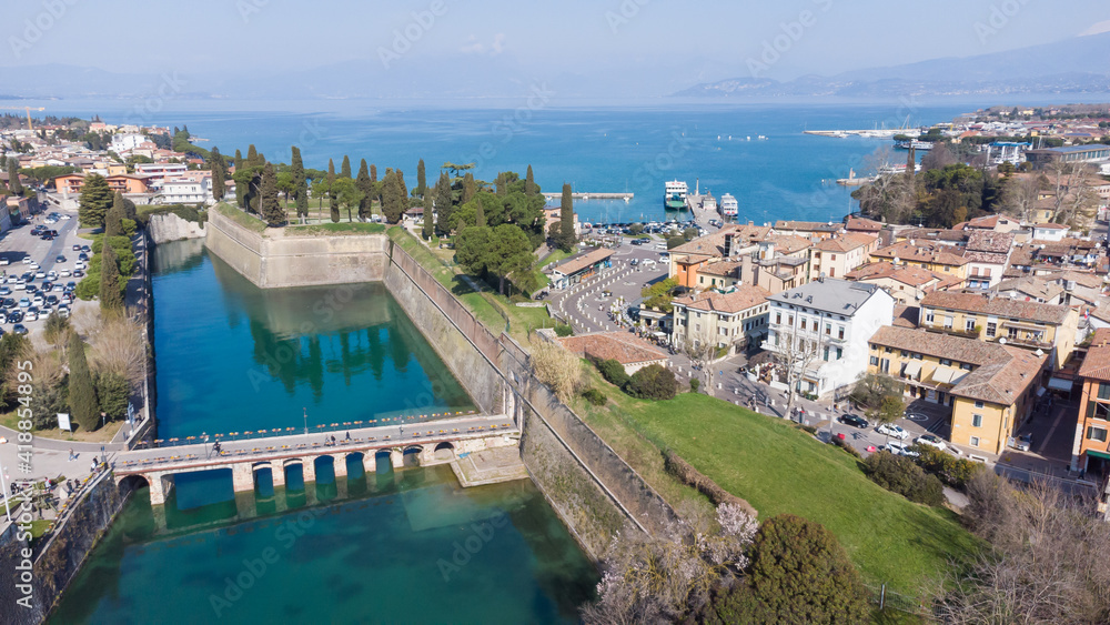 Aerial view of the ancient fortified town of Peschiera dal Garda, protected by mighty Renaissance walls and canals that surround it.
