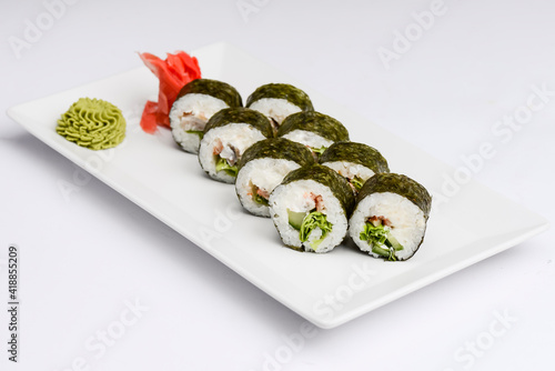 Maki Sushi - Roll made of smoked salmon and cream cheese. Traditional Japanese cuisine concept, over white background.