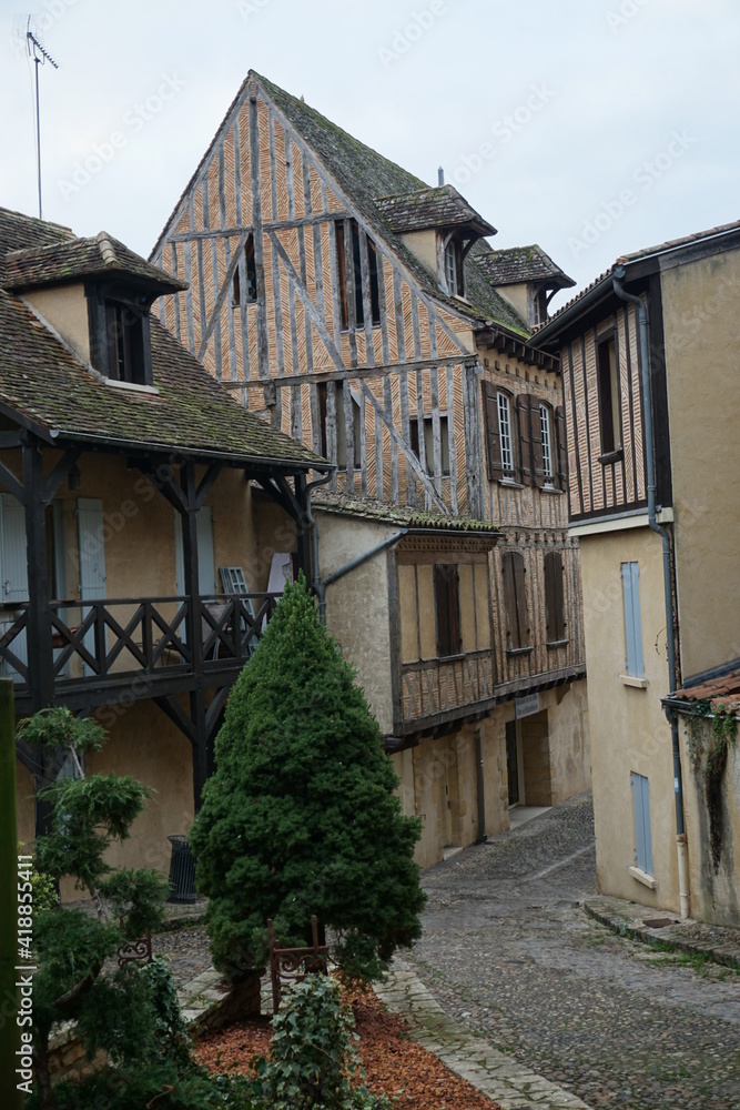 old half timbered houses in the village and cobblestone street in France