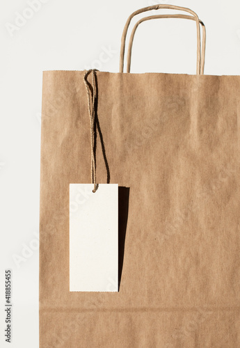 Paper reusable bag with blank white empty label card mock up, Delivery service and shopping concept