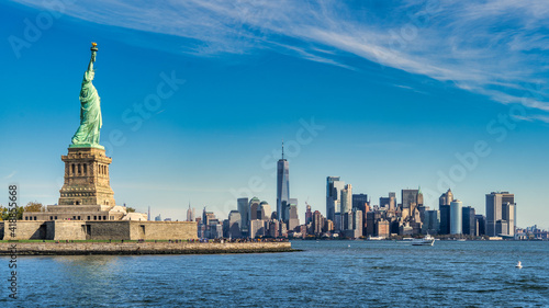 Statue of Liberty with Manhattan downtown Skylines building in background, New York City , NYC USA. © khalid