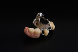 Dental braces and dentures on a black background