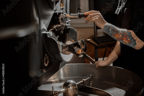confident coffee roaster man is checking preparation process