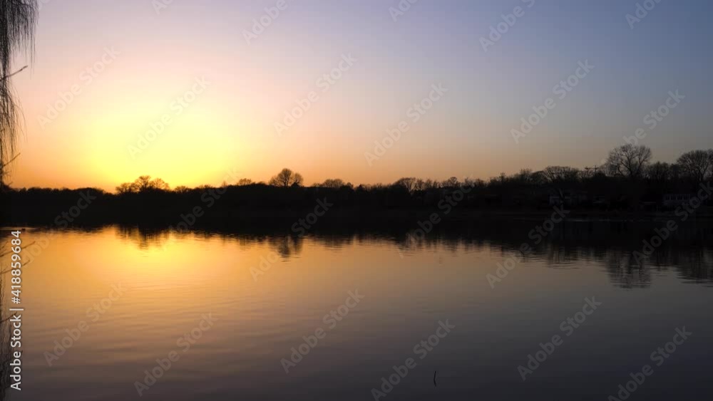 Beautiful calm lake at sunset Beautiful calm lake at sunset
