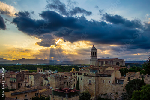 Girona, Spain - July 28, 2019: Cityscape of the city of Girona with the famous Girona cathedral at sunset, Catalonia, Spain © Arty Om