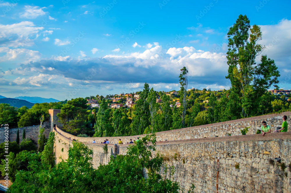 Girona, Spain - July 28, 2019: Scenic view of the historical fortification walls of the city of Girona in Catalonia, Spain