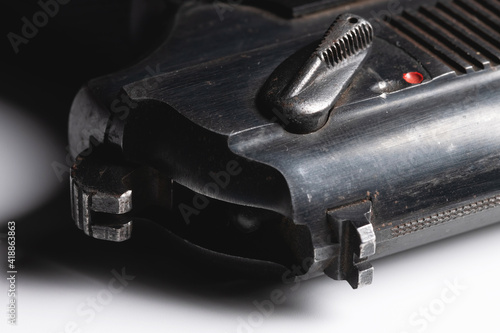 Old Soviet pistol. Close-up on white background