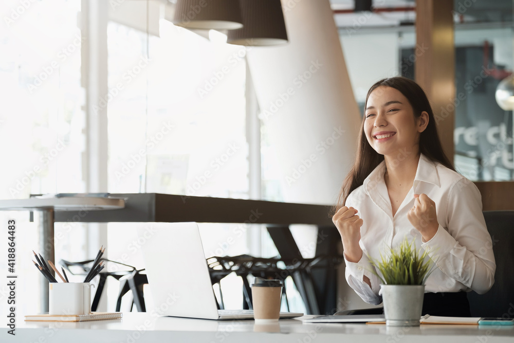 Business Winner - Happy excited successful businesswoman triumphing in office. Business Winner - Happy excited successful businesswoman triumphing in office.