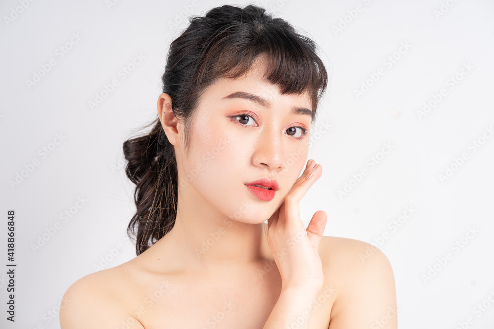 Young Asian woman with beautiful skin on white background Young Asian woman with beautiful skin on white background