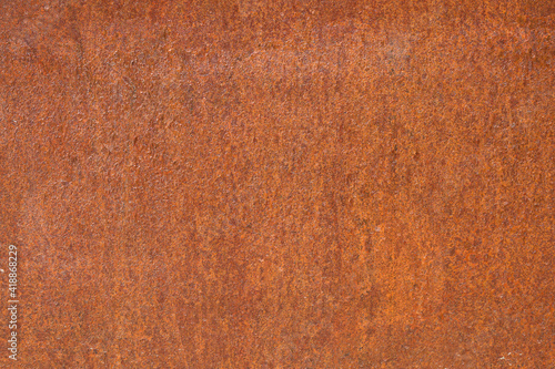 Rusty metal. Terracotta background out of focus
