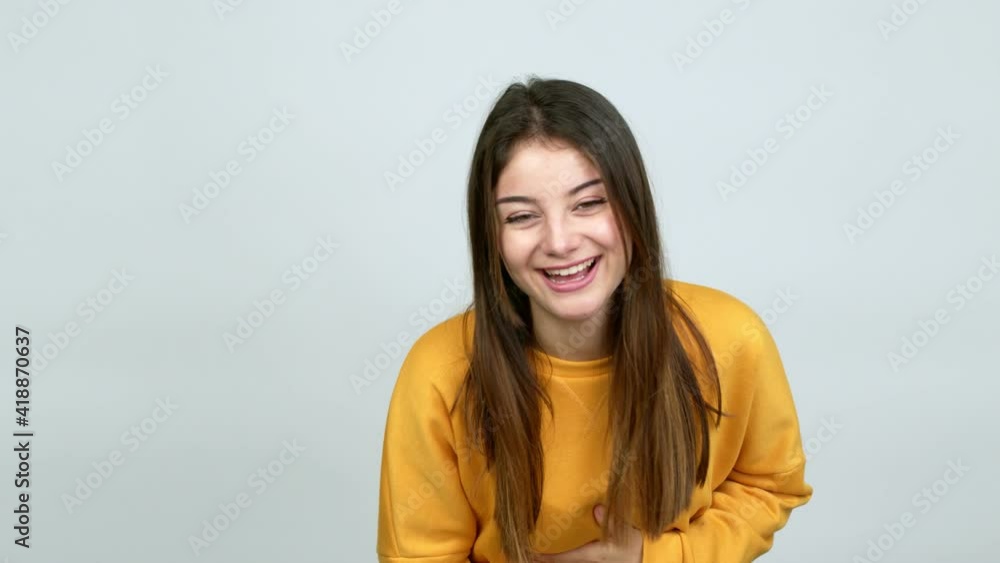 Young caucasian woman smiling a lot while covering mouth over isolated background Young caucasian woman smiling a lot while covering mouth over isolated background