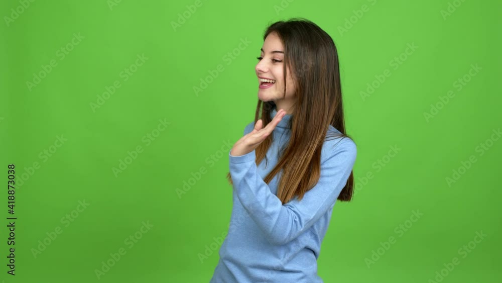 Young caucasian woman saluting with hand with happy expression over isolated background. Green screen chroma key Young caucasian woman saluting with hand with happy expression over isolated background. Green screen chroma key