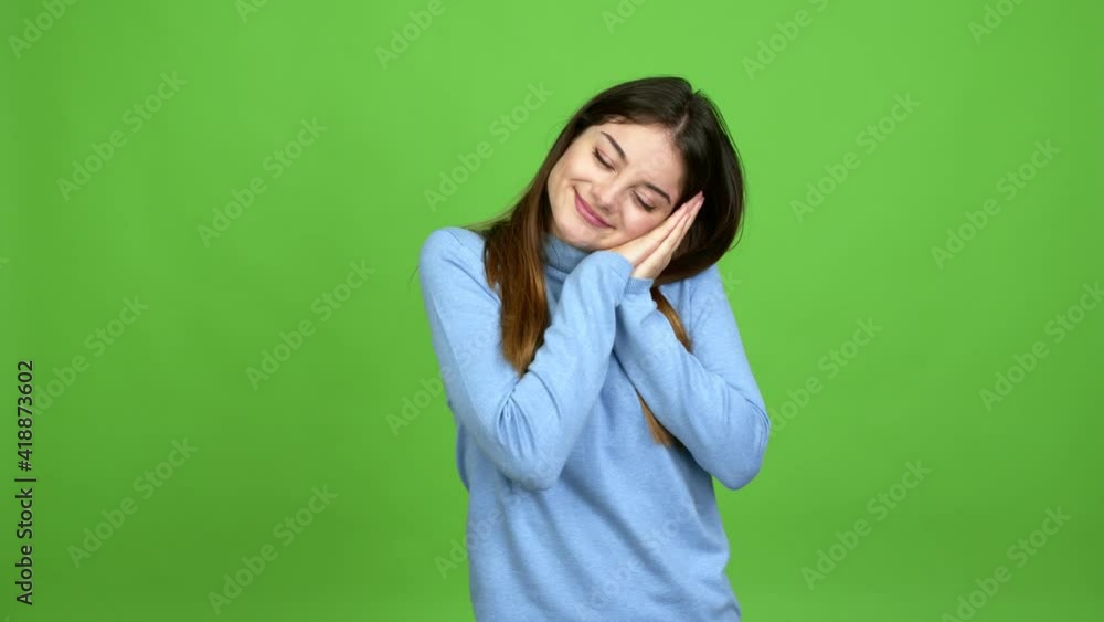 Young caucasian woman making sleep gesture. Adorable and sweet expression over isolated background. Green screen chroma key Young caucasian woman making sleep gesture. Adorable and sweet expression over isolated background. Green screen chroma key