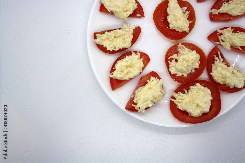 Tomatoes stuffed with cheese with garlic and mayonnaise. Tomatoes stuffed with cheese with garlic and mayonnaise.