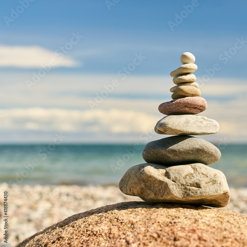 Zen meditation with stack of stones as a Buddhism concept