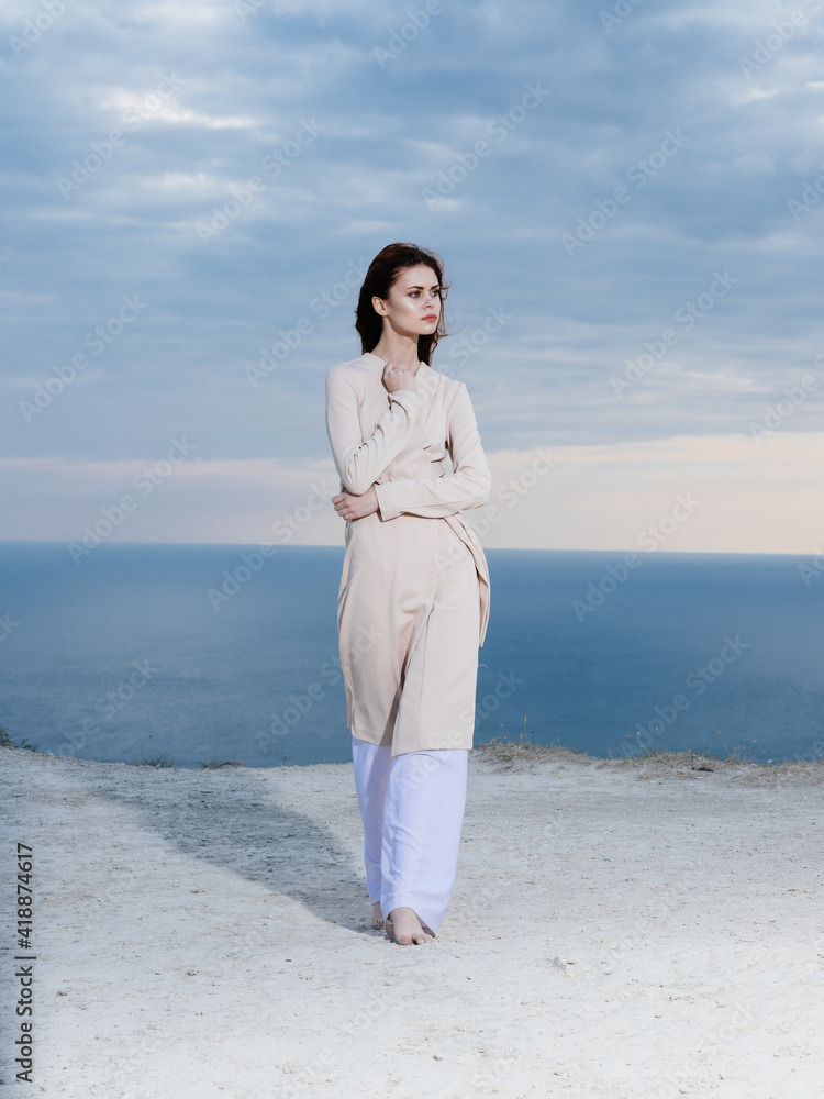 Woman travel on roads in nature and ocean in the background Woman travel on roads in nature and ocean in the background