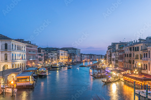 View at sunset, the Grand Canal and palazzos, historic renaissance architecture, UNESCO world heritage site. photo
