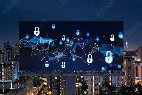 Padlock icon hologram on road billboard over panorama city view of Kuala Lumpur at night to protect business  Malaysia  Asia. The concept of information security shields.