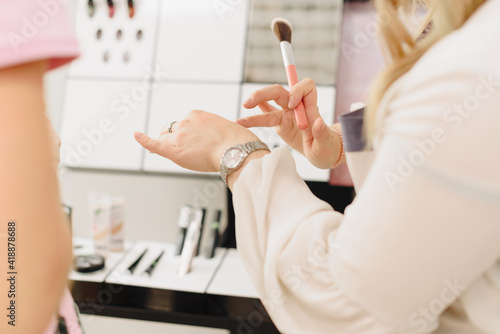 Make-up artist girl's hands with makeup