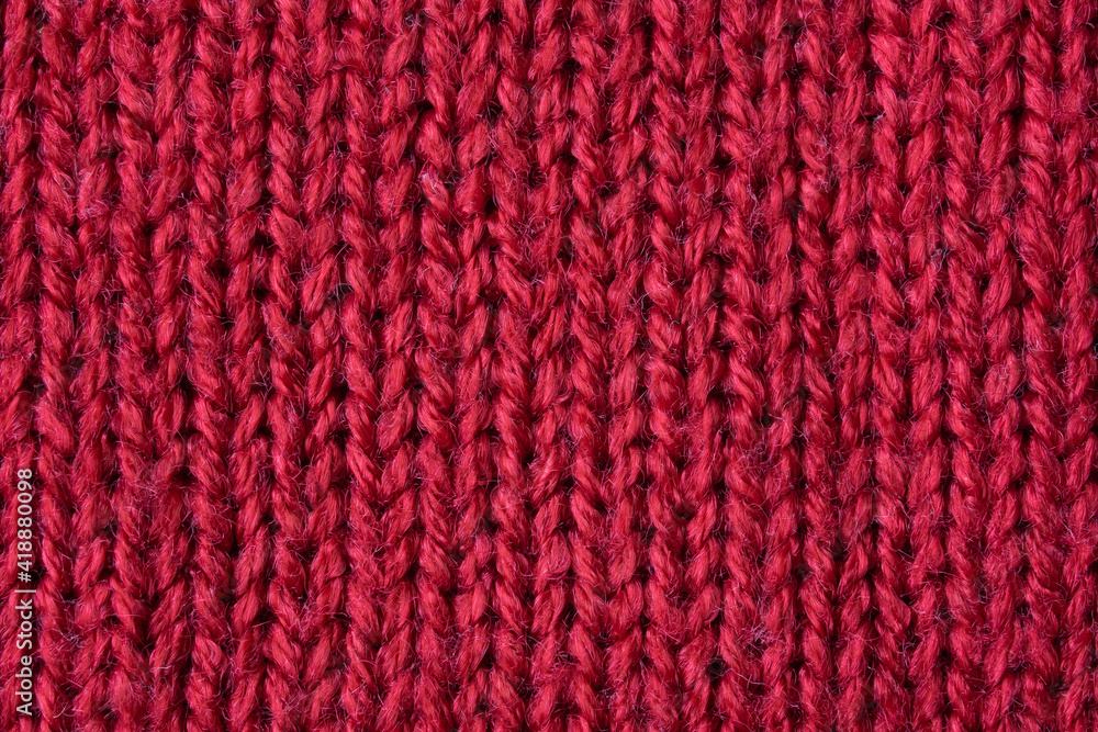 Red knitted wool texture background