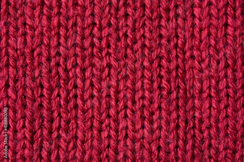 Red knitted wool texture background