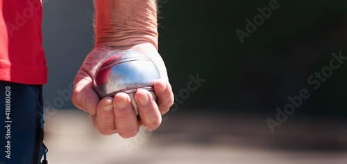Bild auf Leinwand Senior playing petanque fun and relaxing game, man plays petanque with a metal b