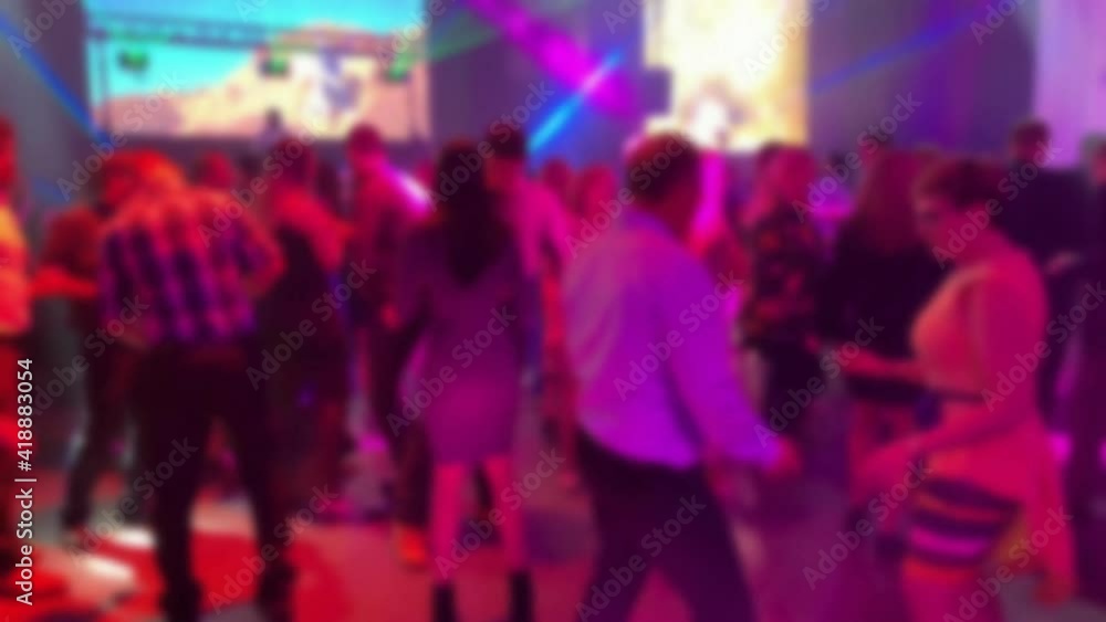 Dancing people at a party. Entertainment program at the wedding. Silhouettes of people dancing at a party. Blurred view. 4K Dancing people at a party. Entertainment program at the wedding. Silhouettes of people dancing at a party. Blurred view. 4K