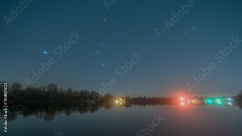 The Orion constellation over the quarry lake Kiefweiher near Ludwigshafen in Germany.