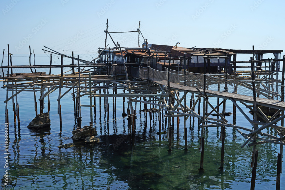 Traditional trabocco, wooden fishing house on platform, Gargano Coast, Abruzzo, Italy, fishing or travel concept