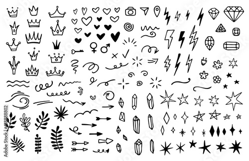 Vector set of different crowns, hearts, stars, crystals, sparkles, arrows, lightnings, diamonds, signs and symbols. Hand drawn, doodle elements isolated on white background. photo