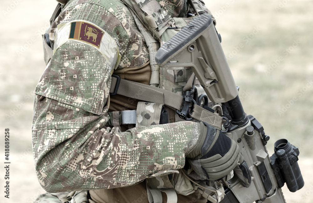 Soldier with assault rifle and flag of Sri Lanka on military uniform. Collage. Soldier with assault rifle and flag of Sri Lanka on military uniform. Collage.