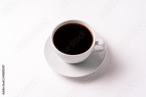 Flat lay black coffee in a white cup isolated on white background.