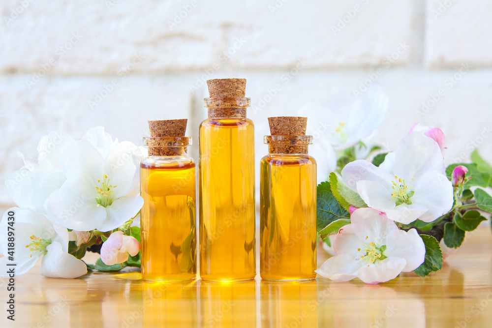 Essence of flowers on table in beautiful glass jar Essence of flowers on table in beautiful glass jar