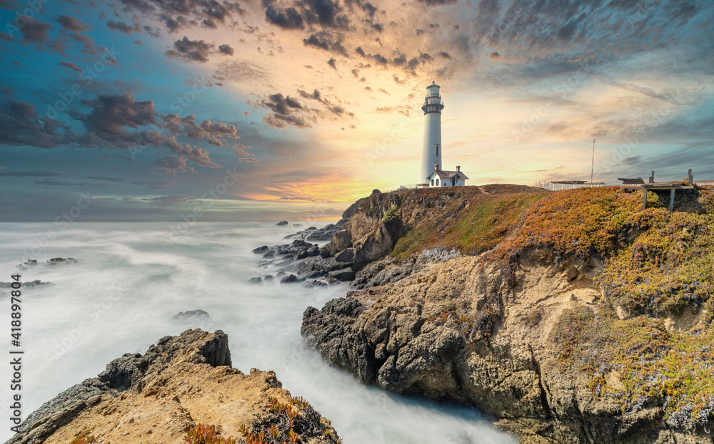 Pigeon Point Lighthouse against the backdrop of the beautiful sky and ocean with long exposure waves, a great landscape of the Pacific coast in California