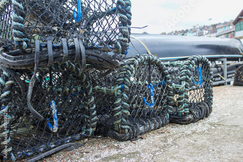 LoCollection of empty lobster pots on the quayside