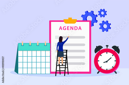 Businesswoman looking at agenda list on the clipboard with calendar and alarm clock